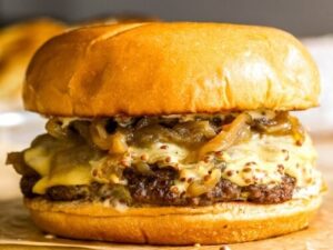 Casey’s smash burgers with cheese, pickles and grilled onions